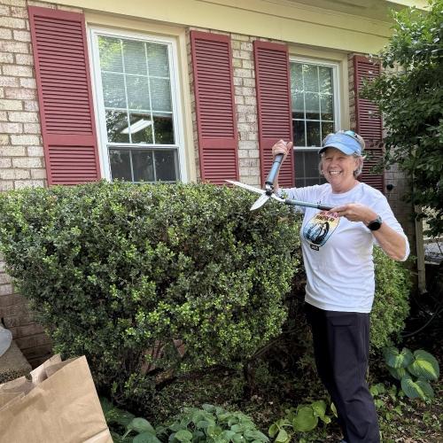 woman trimming bush