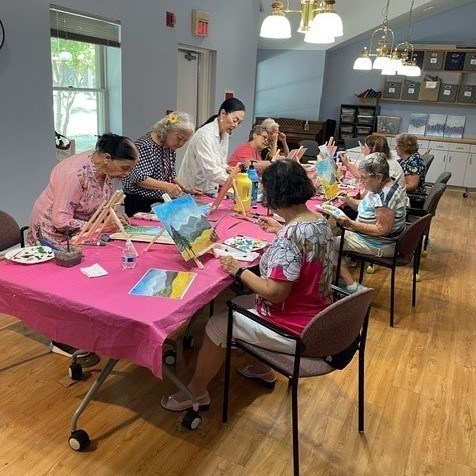 George Bishop teaching art class