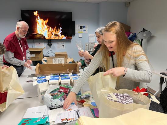 people filling gift bags 