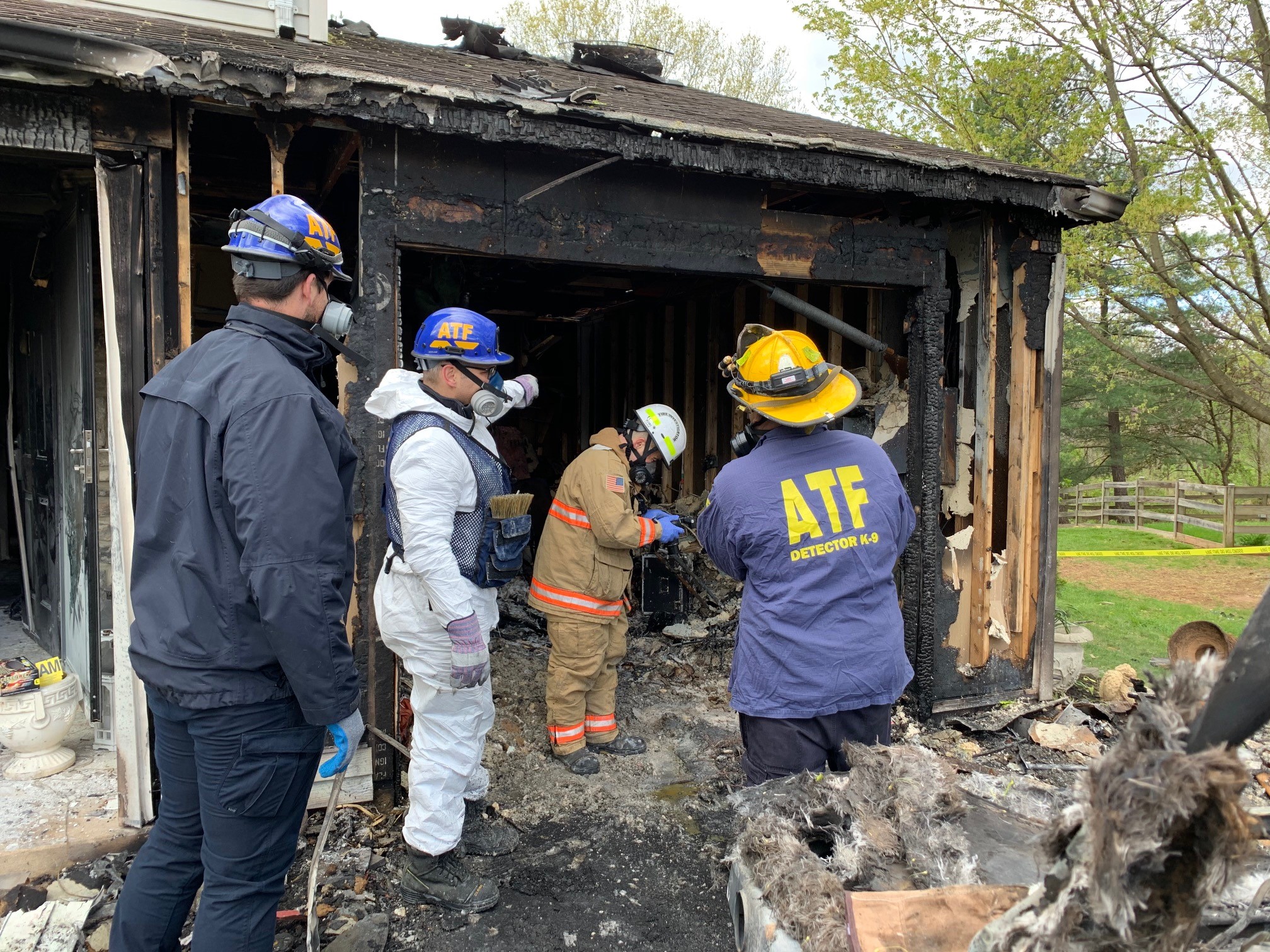 Investigators collaborating with ATF and on-scene fireman