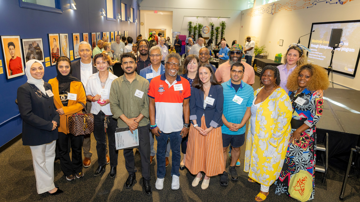 Group of people posing together and smiling