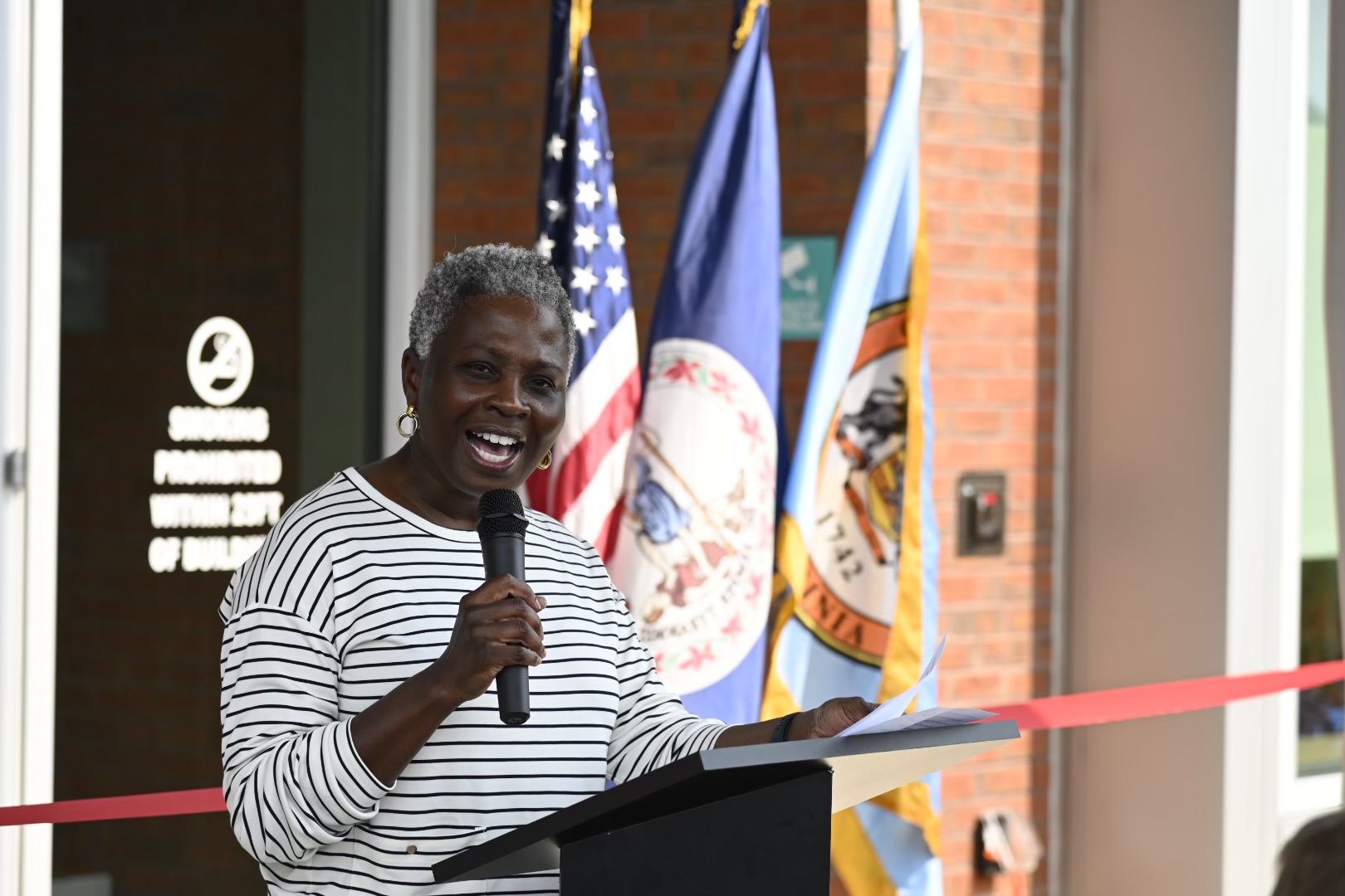 Dr. Gloria Addo-Ayensu speaking at the Sully Community Center grand opening