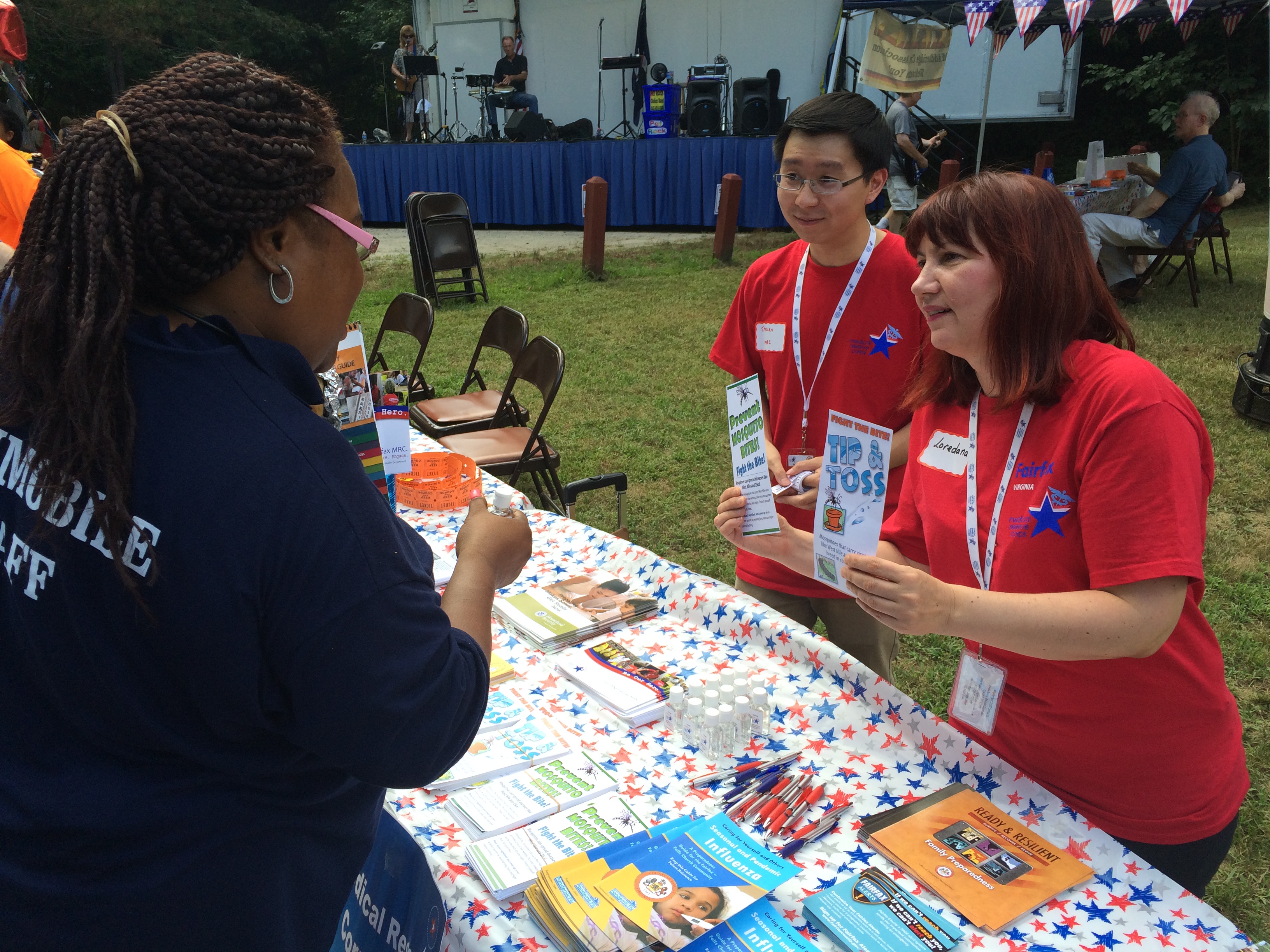 Two people showing pamphlets