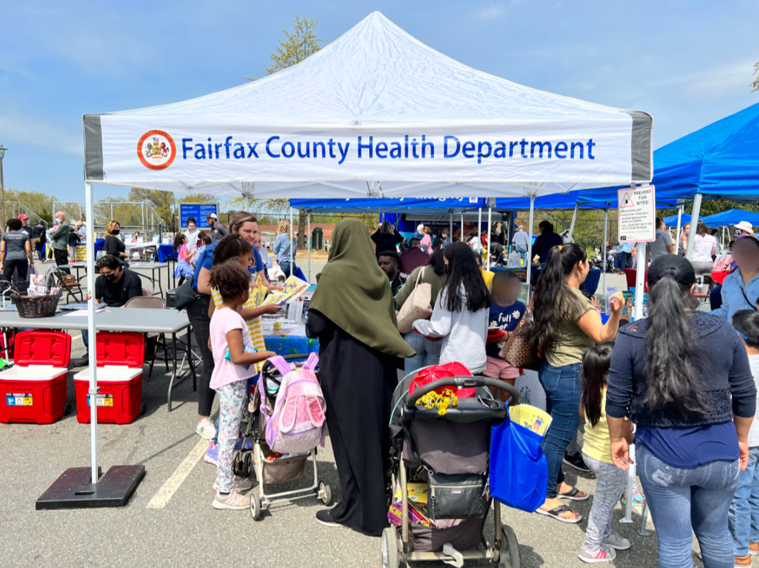 People at the Health Department information table