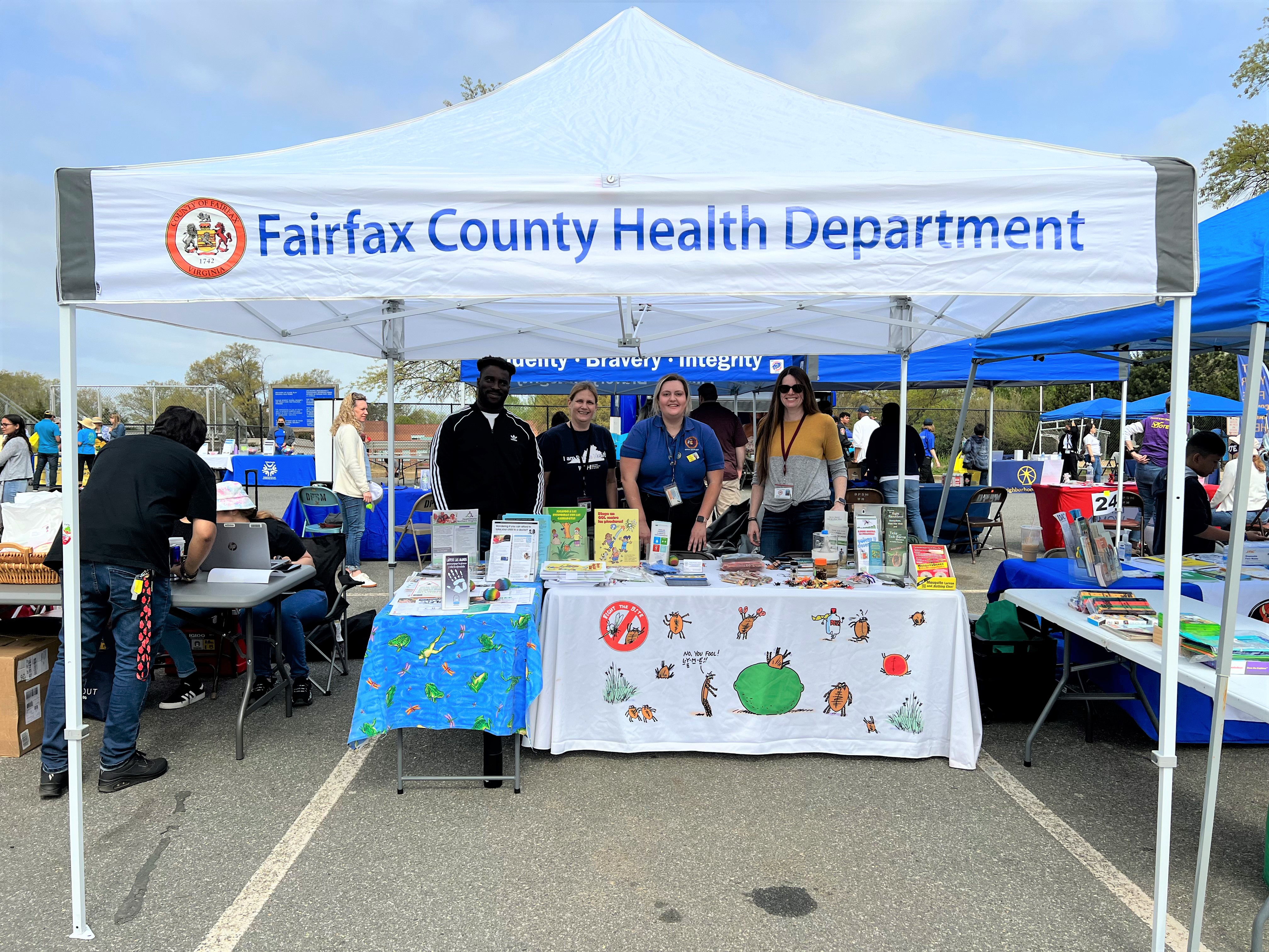 Staff at a Health Department information table