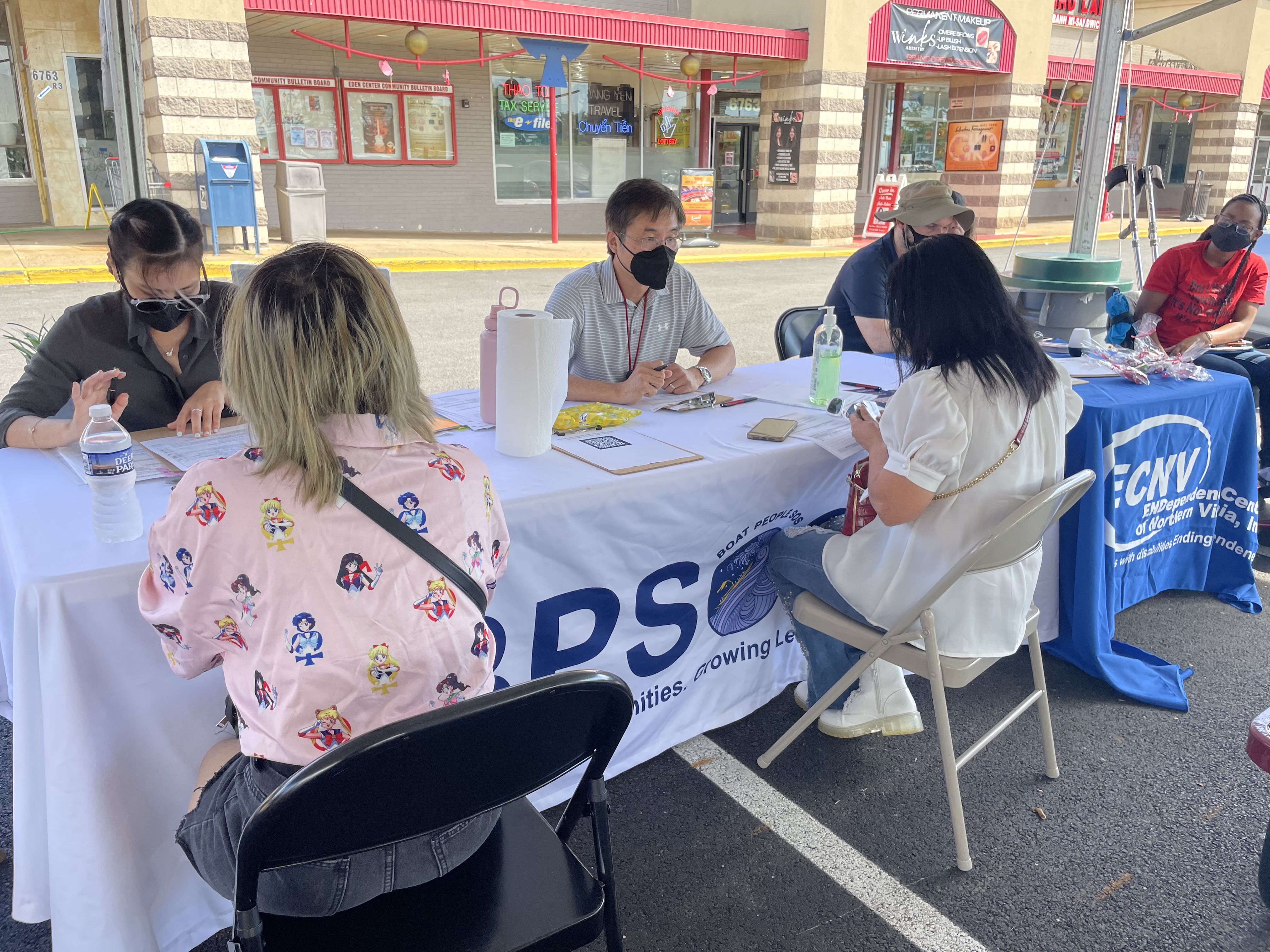 Community members signing up for COVID-19 vaccine at event