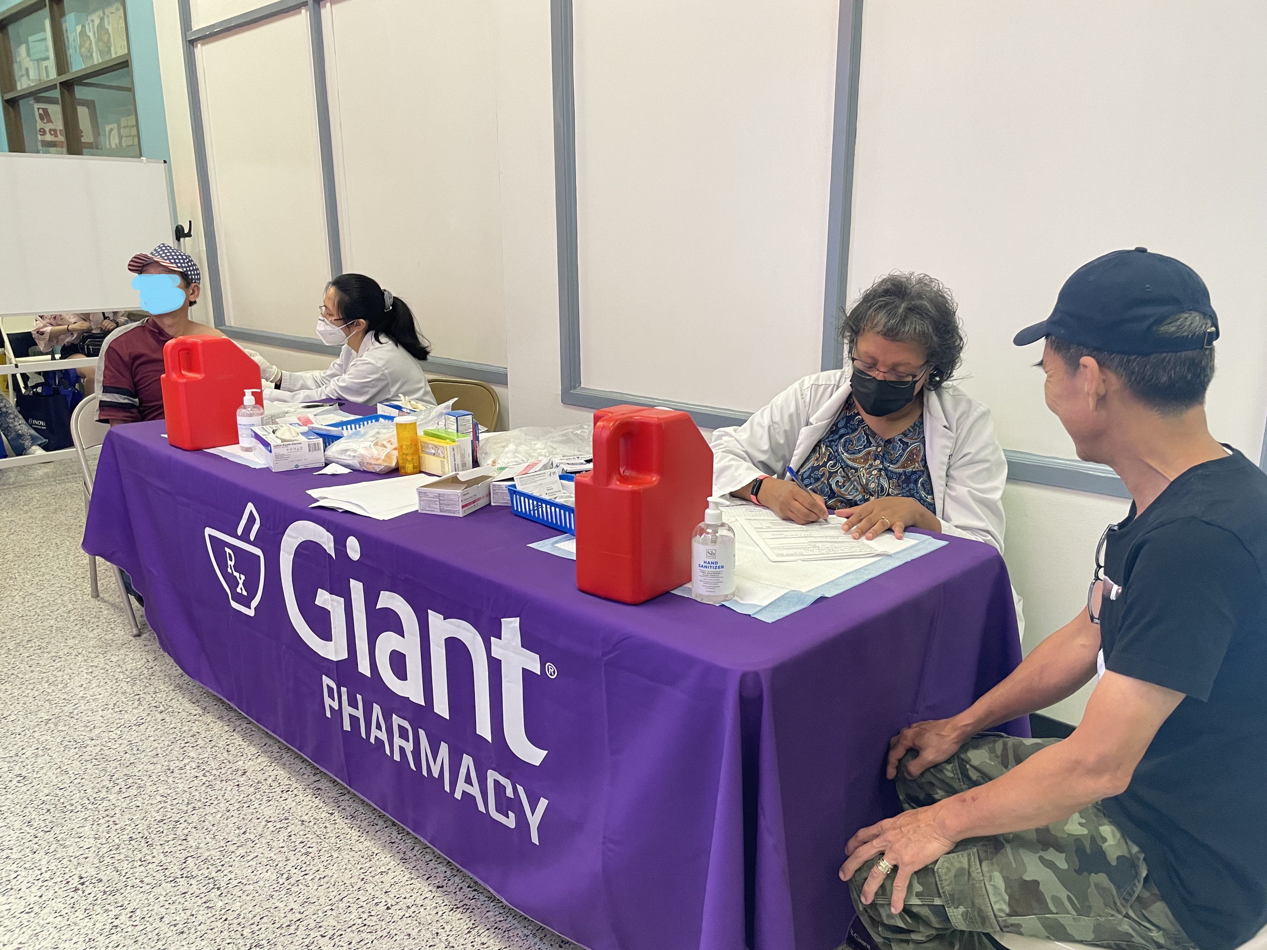 Community members getting vaccinated at COVID-19 clinic