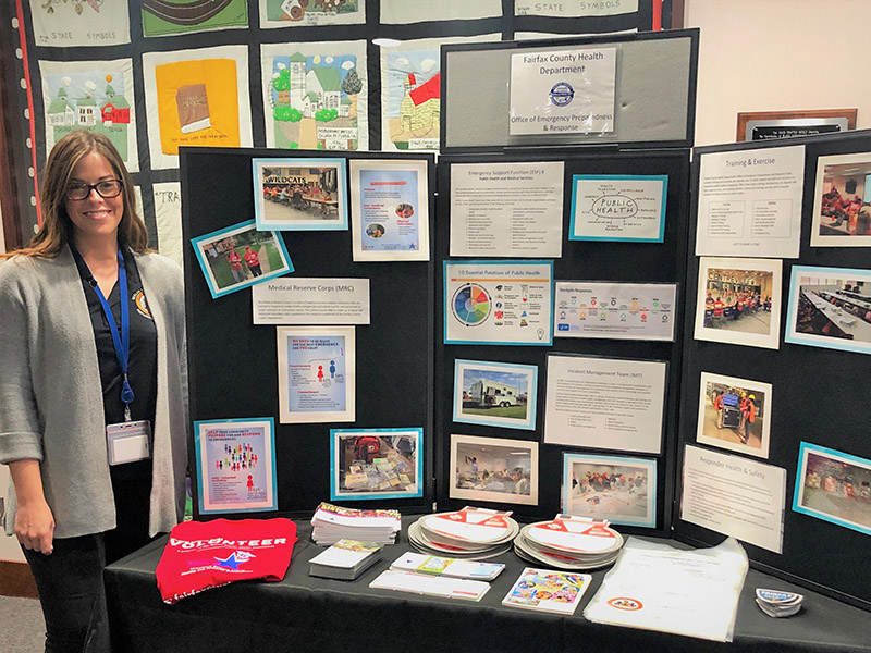 Office of Emergency Preparedness and Response team member staffs a display at the 2018 HHS Fall Forum
