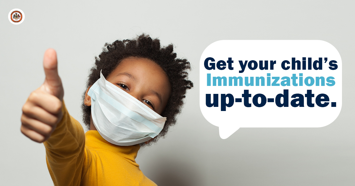 Boy wearing a mask giving thumbs up. Text: Get your child's immunizations up-to-date.