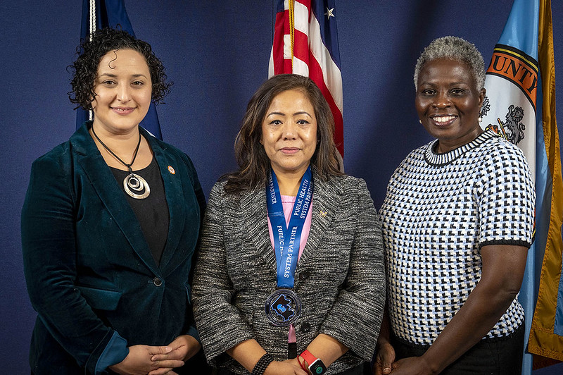 Prabha Bhattarai Deuja, center, with Dalia Palchik,  Providence District Supervisor (left) and Dr. Gloria Addo-Ayensu, Fairfax County Health Director (right). 