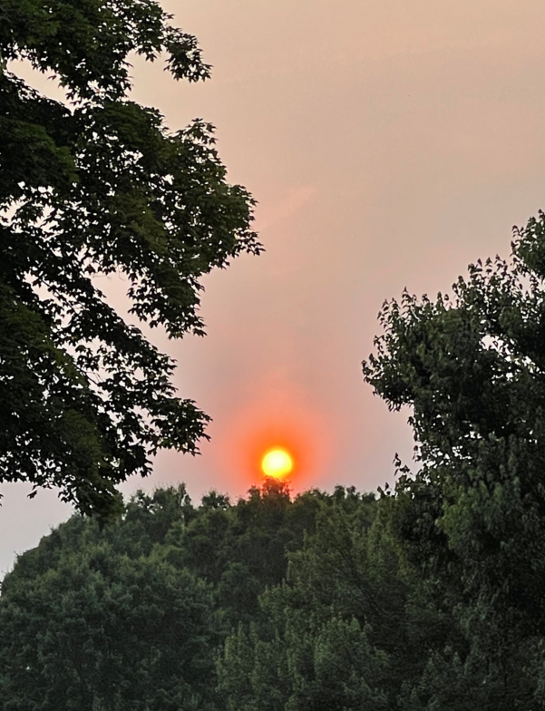 A hazy sunset due to wildfire smoke