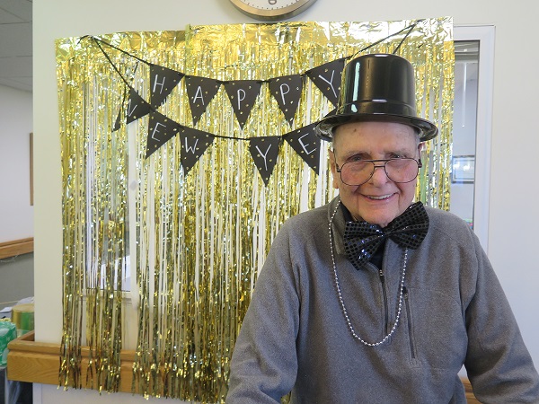 Herndon Harbor Adult Day Health Care participant Bob enjoys New Year's celebrations