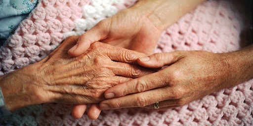 Mother and daughter holding hands