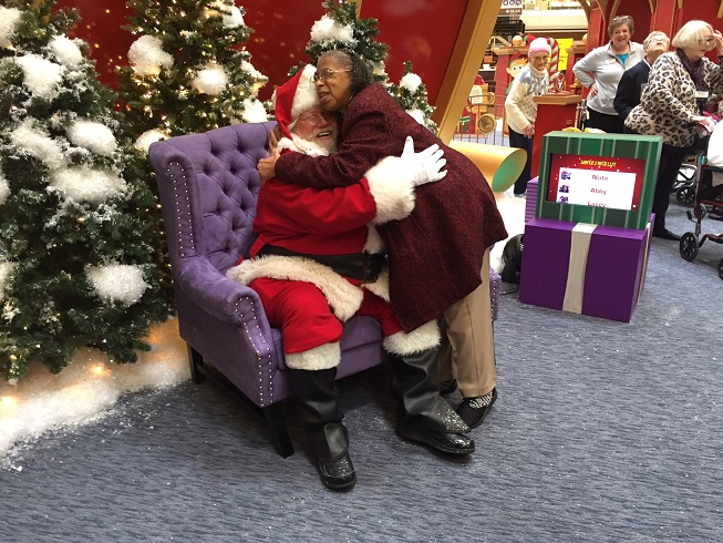 Adult Day Health Care participant visits Santa