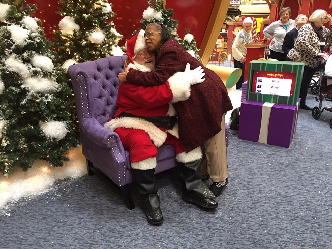 Adult Day Health Care participant visits Santa