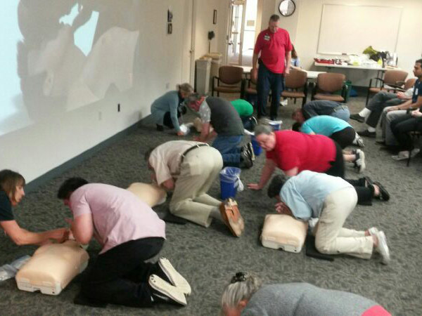 MRC volunteers practice their cardiopulmonary resuscitation during training