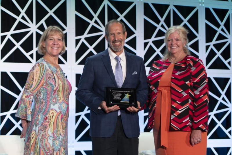 Chris Revere accepts a NACCHO’s Gold Innovative Practice Award