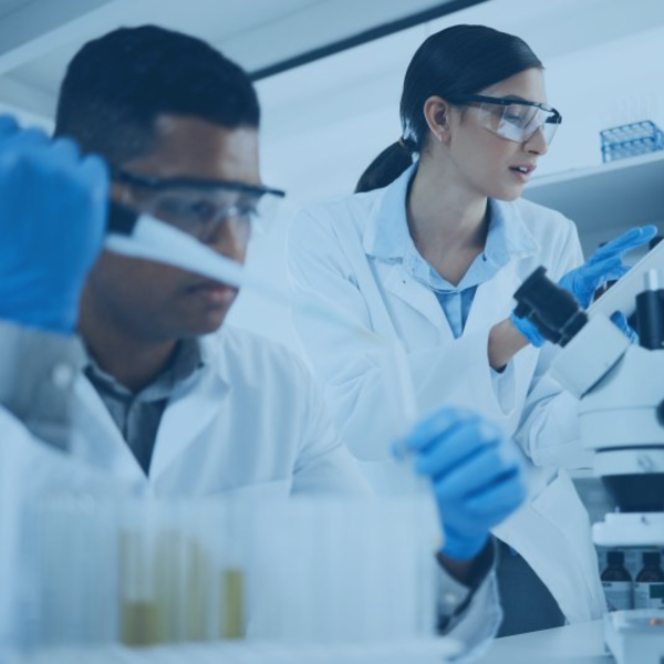 Photo of two lab techs in lab coats