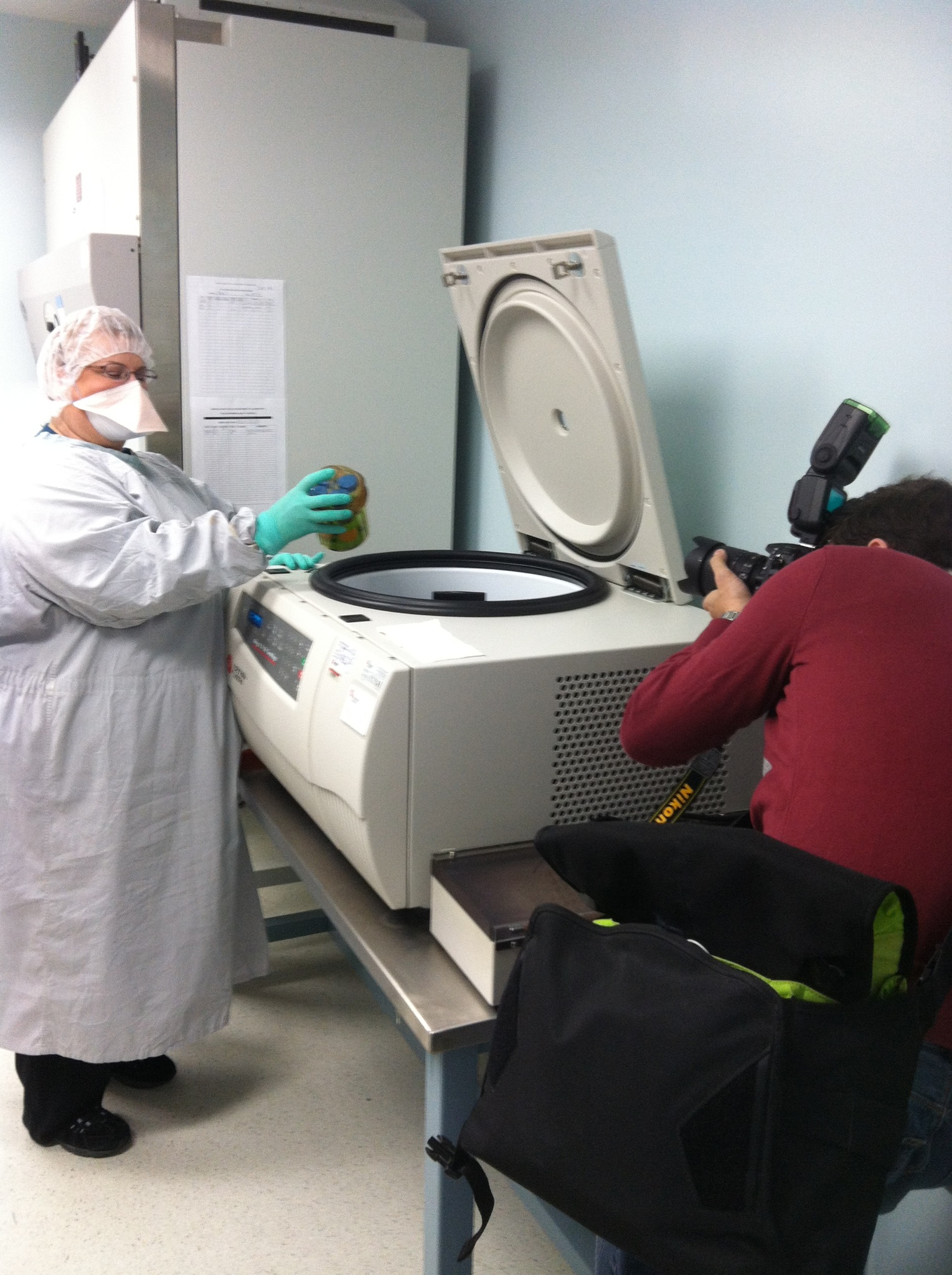 Mary Louise Kolodziej wears personal protective equipment while working in the laboratory