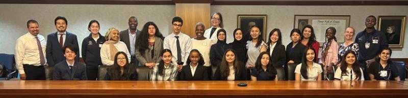 Youth ambassadors pose with med student mentors and program staff