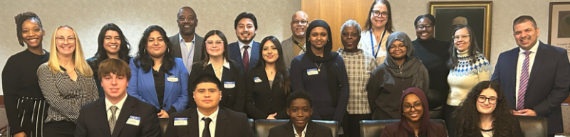 group photo of ten high school students and two teachers, with Health Department staff and 