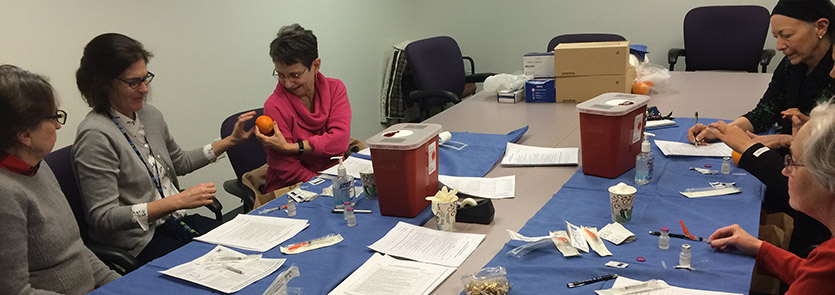 MRC volunteers prepare vaccination supplies
