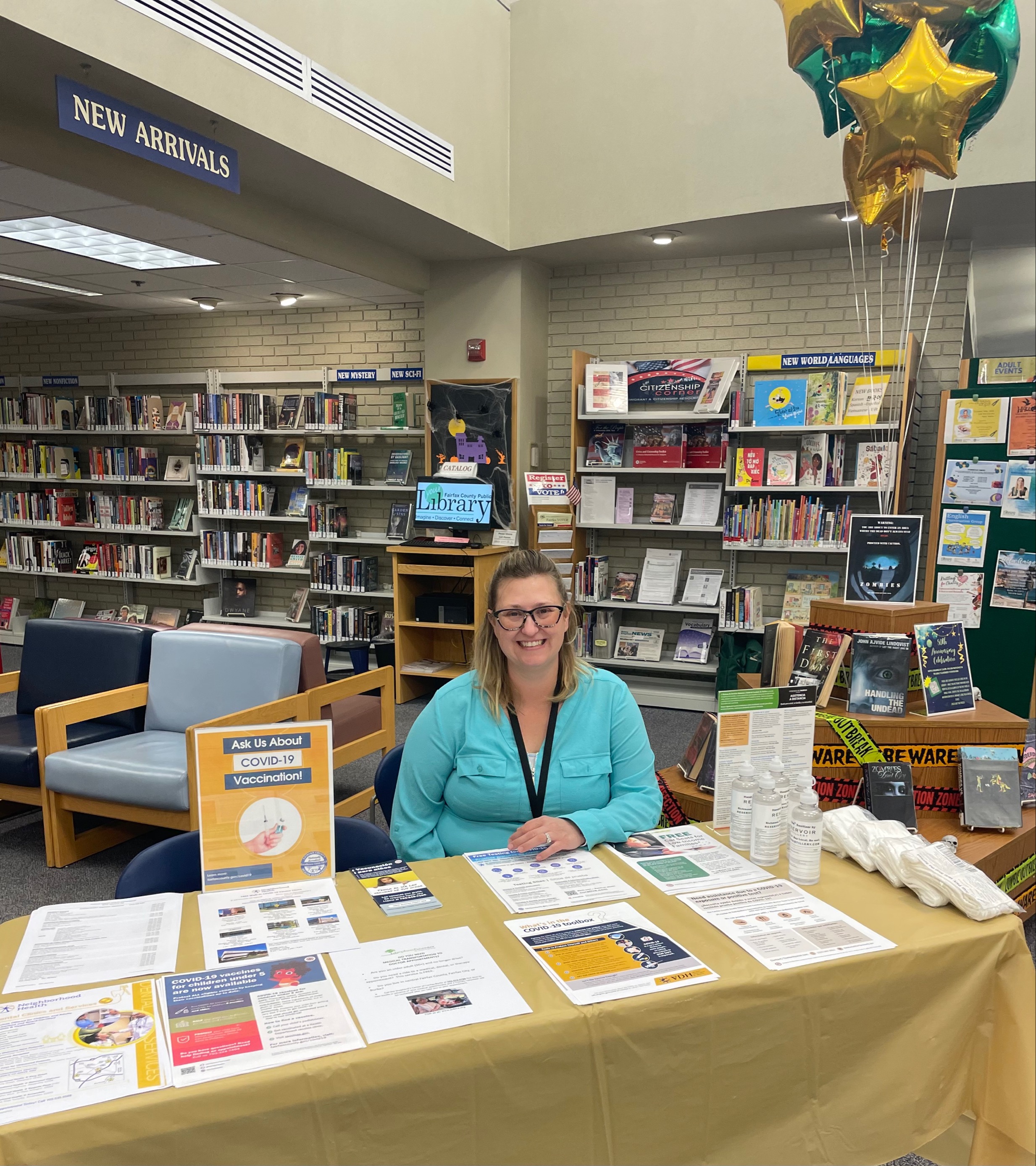 Community health worker tabling at Kings Park Library