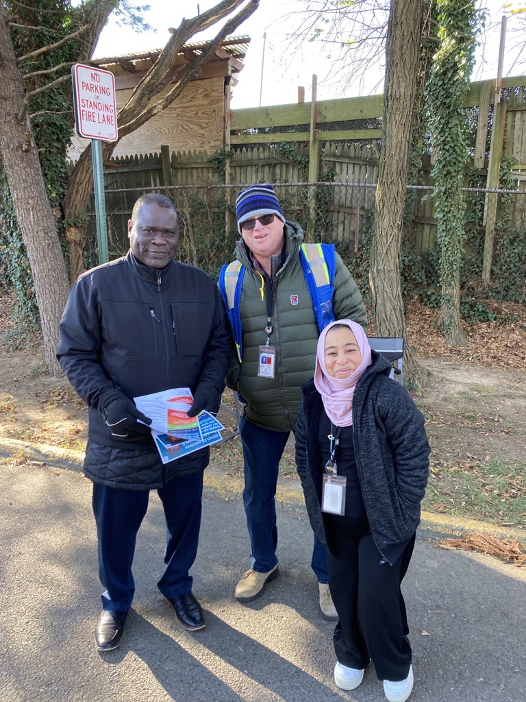 Community health workers outside at food distribution event