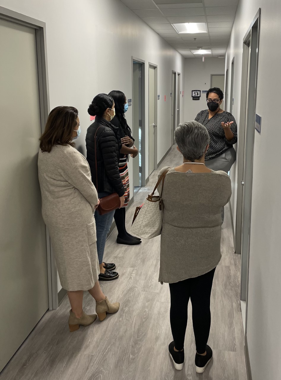 Family liaisons receiving a tour of a health clinic