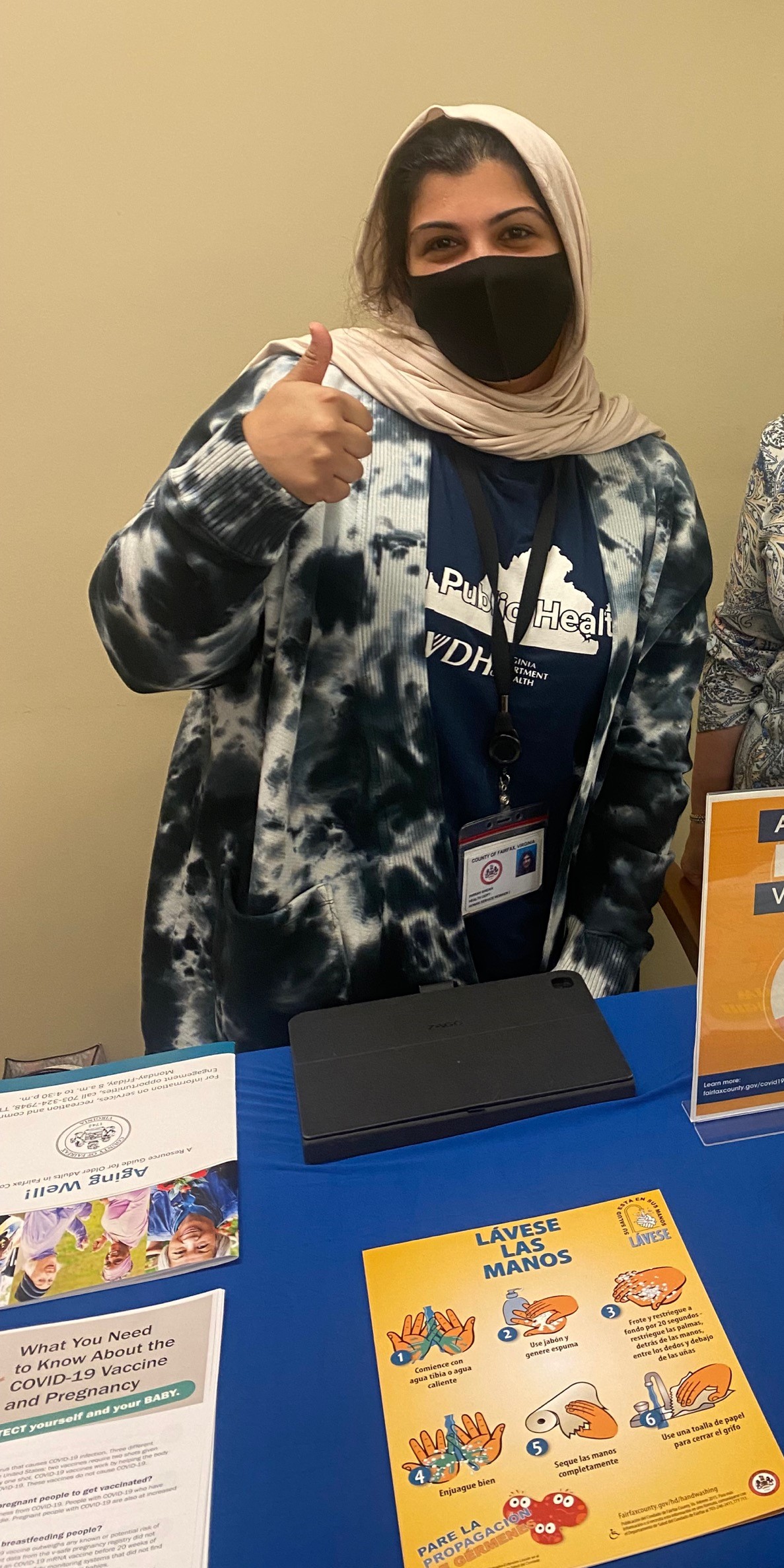 Community health worker with information flyers
