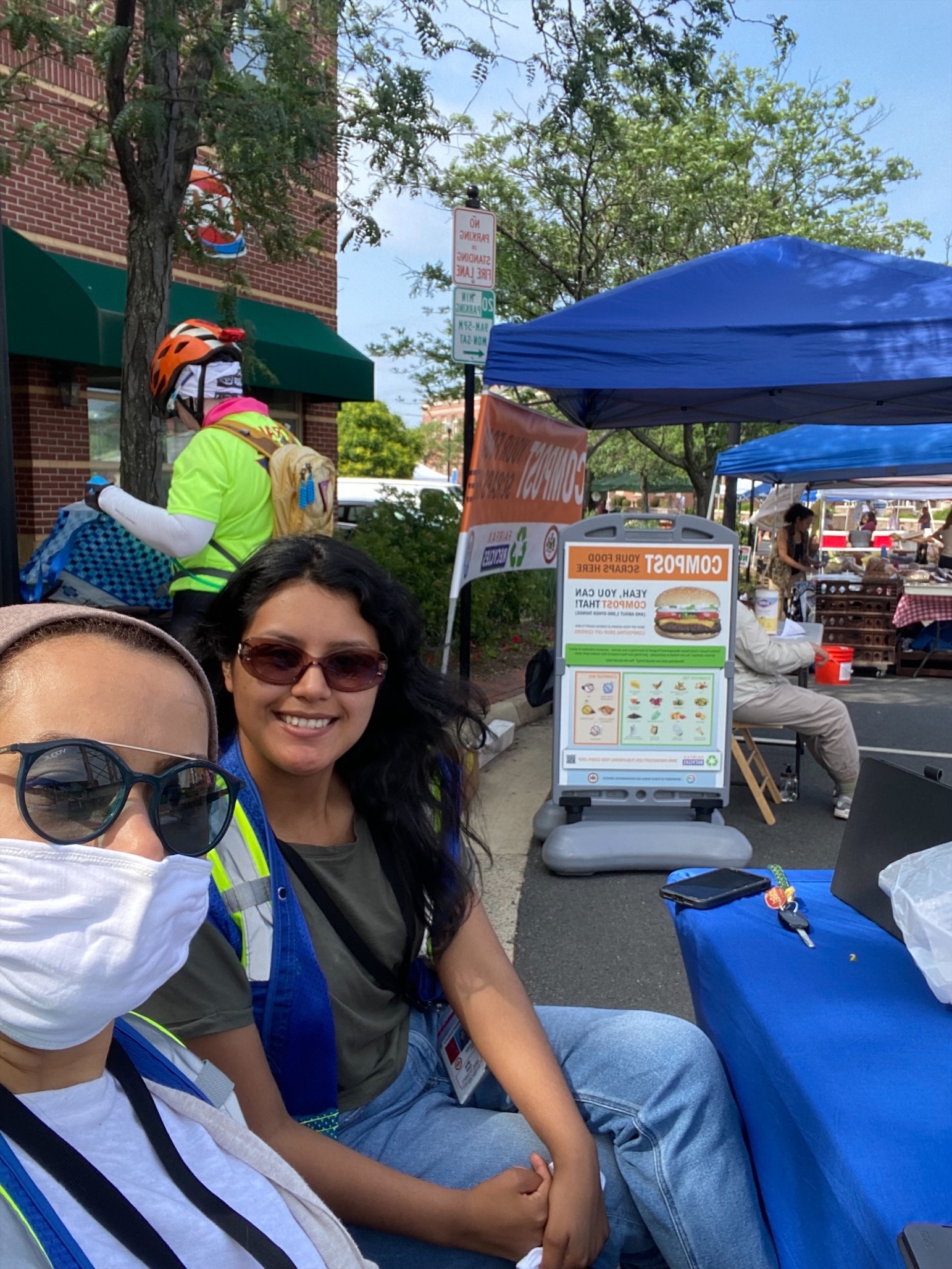 Community health workers at information table at farmers market