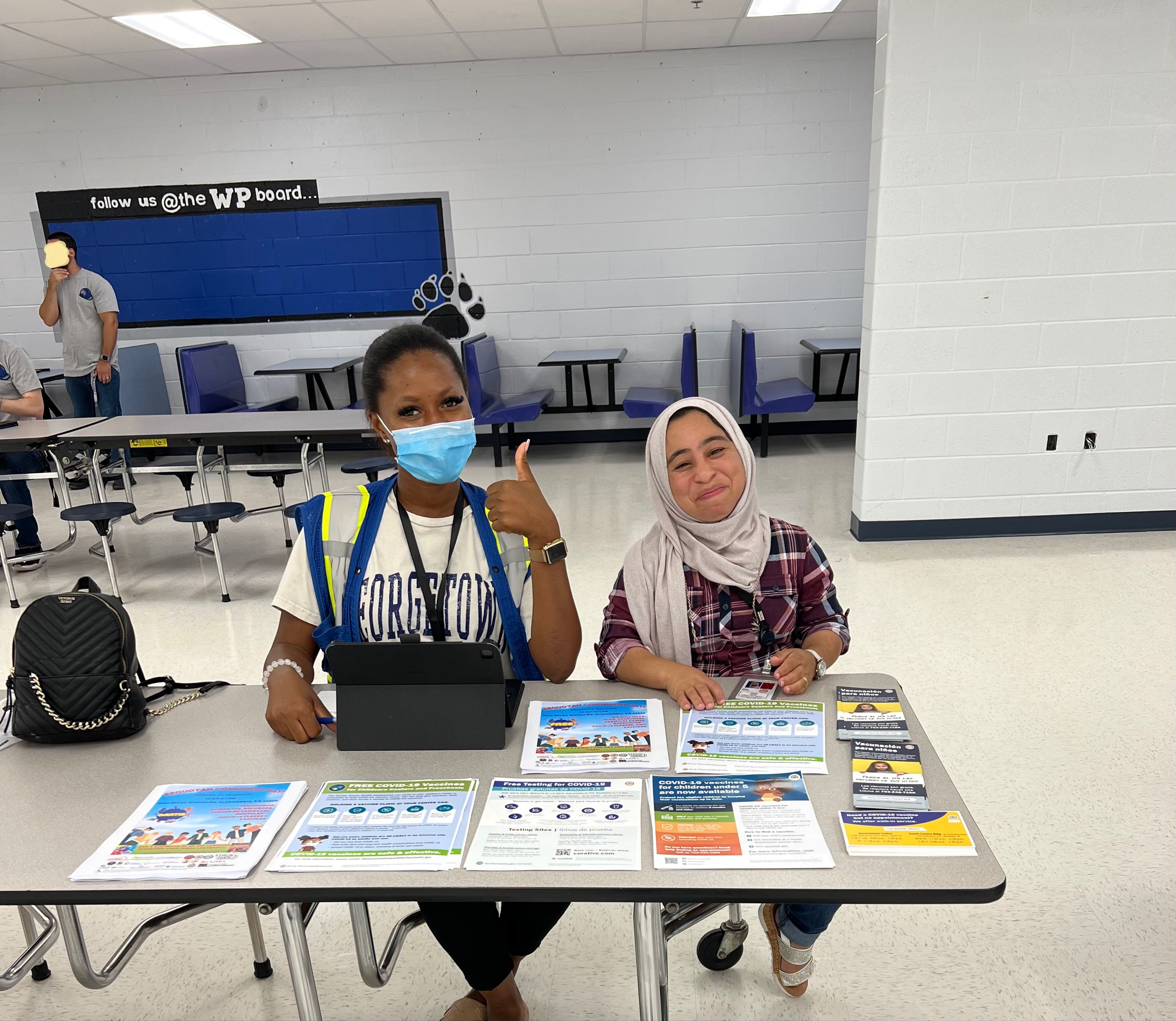 Community health workers at West Potomac High School back-to-school fair