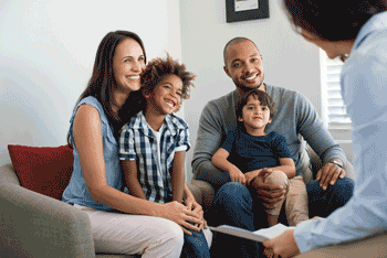 Photo of parents with young children at family counseling