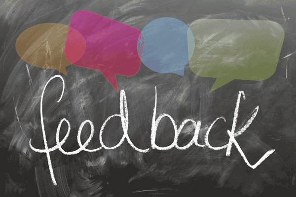 Feedback written on chalk board with speech bubbles above