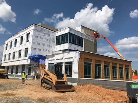 Outside view of construction progress, Tyvec is visible