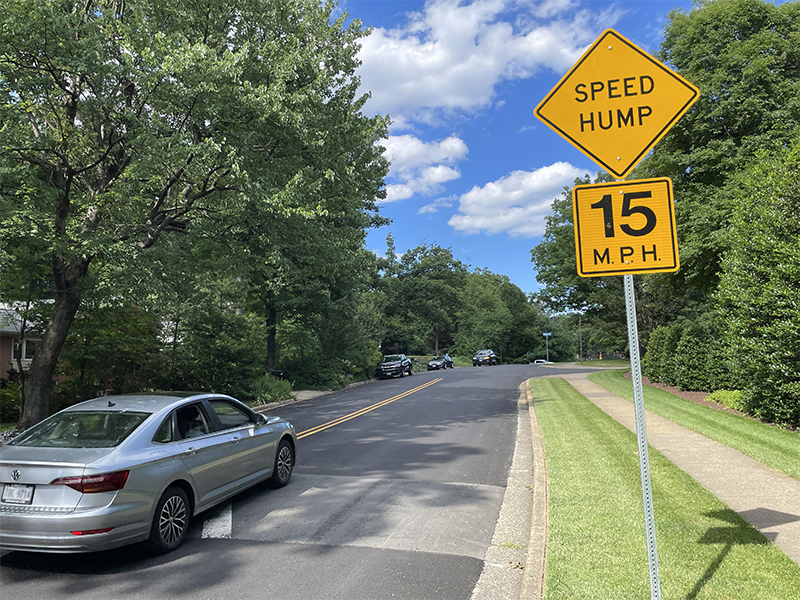 Car driving over a speed hump on Fairway Drive