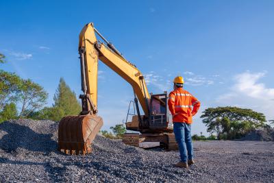man looking at site equipment