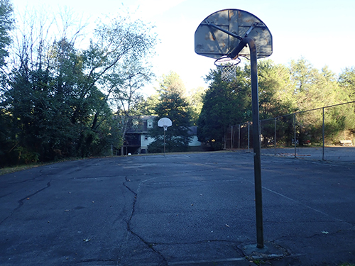 Photo of basketball court before conversion.