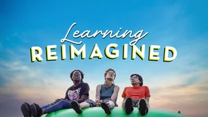Three kids sitting on a green hill at sunset with the words “Learning Reimagined” in the sky above them.