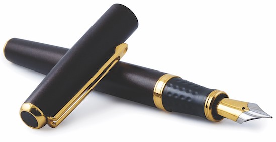 fountain pen with cap resting across its top