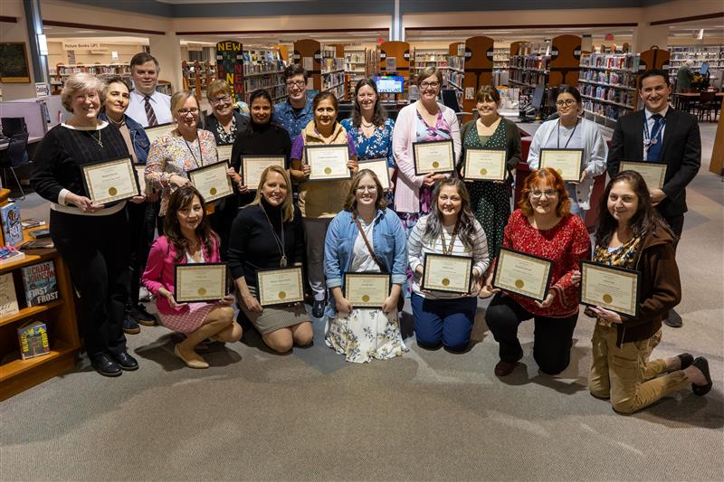 Winner of the FCPL 2025 Staff Excellence Awards posing for a photo with their certificates.