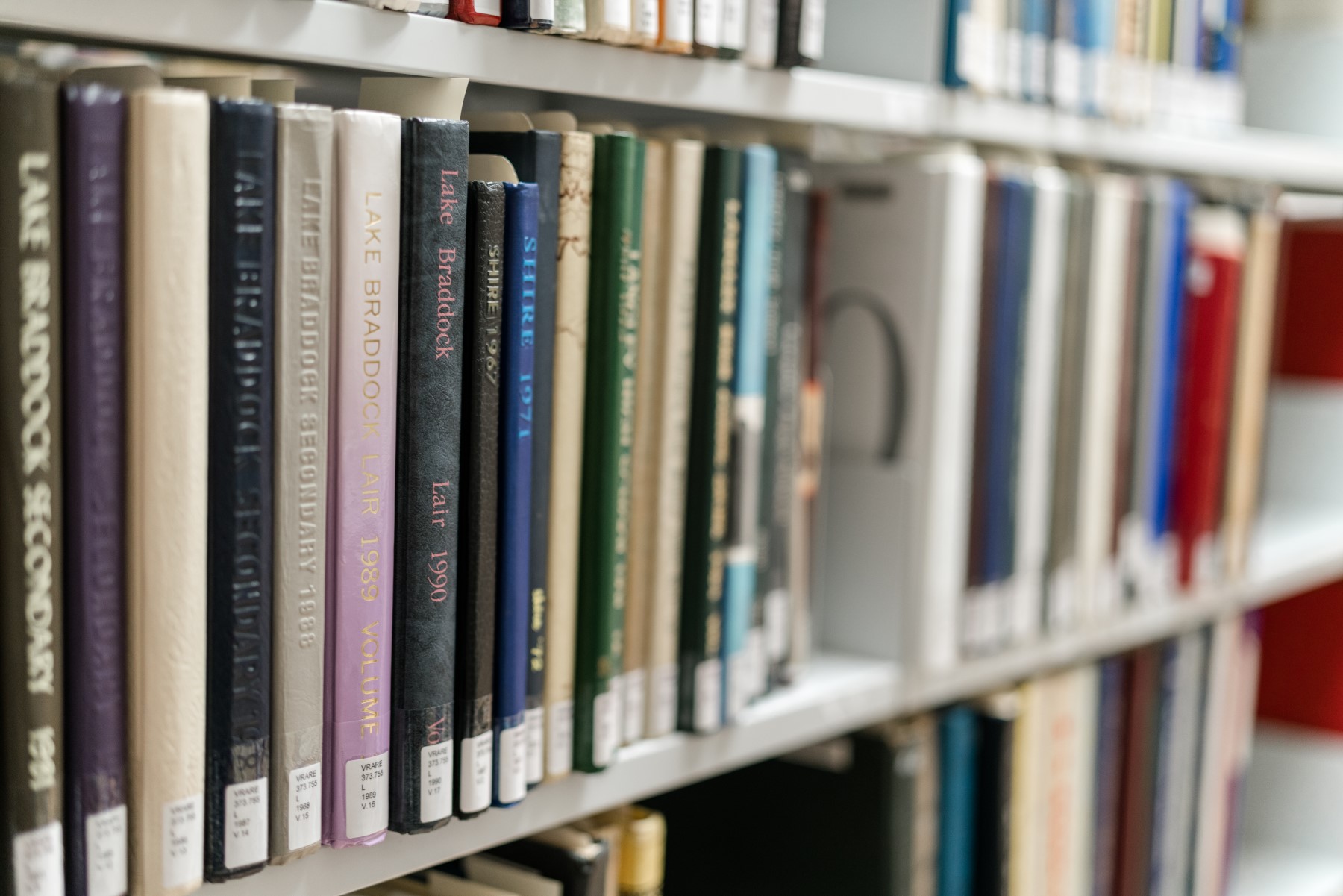a shelf in the Virginia Room library holding rows of local yearbooks