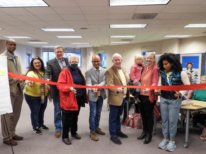 Community and library leaders cut a ribbon at the grand opening of the Maker Lab at Herndon Fortnightly Library. 