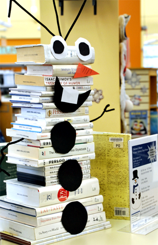 Stack of white books made to look like the snowman Olaf from Disney's "Frozen"