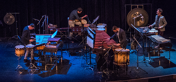 Photo of Third Coast Percussion performing on stage in concert