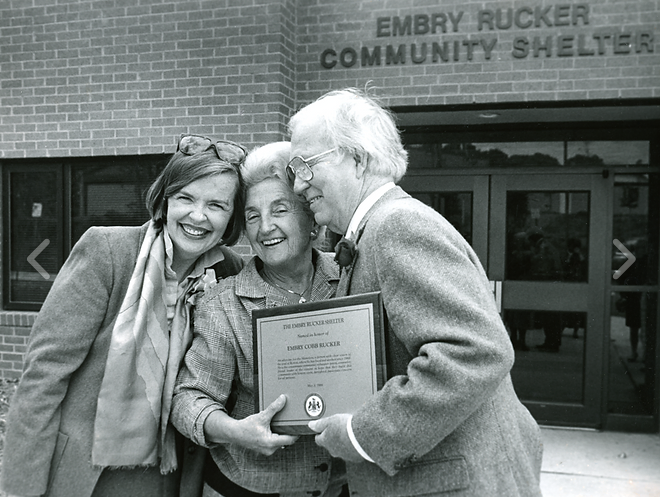 Priscilla Ames, Martha Pennino and Embry Rucker celebrate the opening of the Embry Rucker Community Shelter in Reston. 