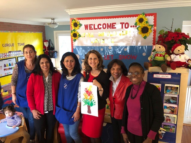 First Lady Pamela Northam and group of people at family child care home.