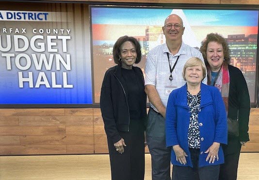 CCAAD Steering Committee members looking at camera