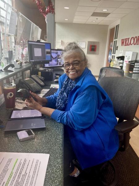 Alma Amaker in a blue sweatshirt at work at James Lee Community Center 