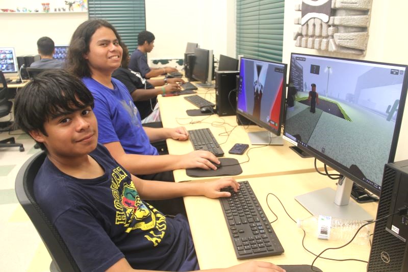 Boys using technology at an NCS center 